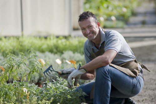 Hatch End gardeners using protective equipment during maintenance